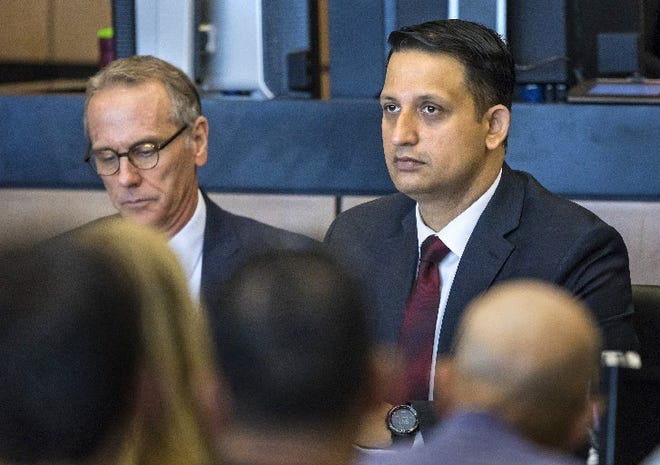Nouman Raja and attorney Scott Richardson (left) listen as the judge talks to potential jurors for Raja's trial Friday in West Palm Beach February 22, 2019. Raja, a former Palm Beach Gardens police officer, is charged with shooting and killing stranded motorist Corey Jones Oct. 18, 2015. He is charged with manslaughter by culpable negligence while armed and attempted first-degree murder with a firearm. [LANNIS WATERS/palmbeachpost.com] POOL