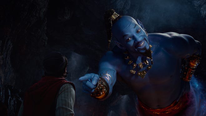 Aladdin (Mena Massoud) meets the larger-than-life blue Genie (Will Smith) in Disney’s live-action adaptation "Aladdin." [Walt Disney Pictures]