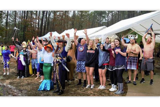 WHAT COLD? — Participants in the 2019 Chatham Sheriff’s Office Polar Plunge pose after testing the chilly waters of Jordan Lake on Feb. 23. (Contributed photo)
