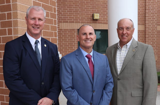 Kenneth Wagner (from left), newly hired chief of Clay County District Schools police force, Clay schools Superintendent Addison Davis and retired Clay County Sheriff Rick Beseler. [Clay County District Schools/Provided]