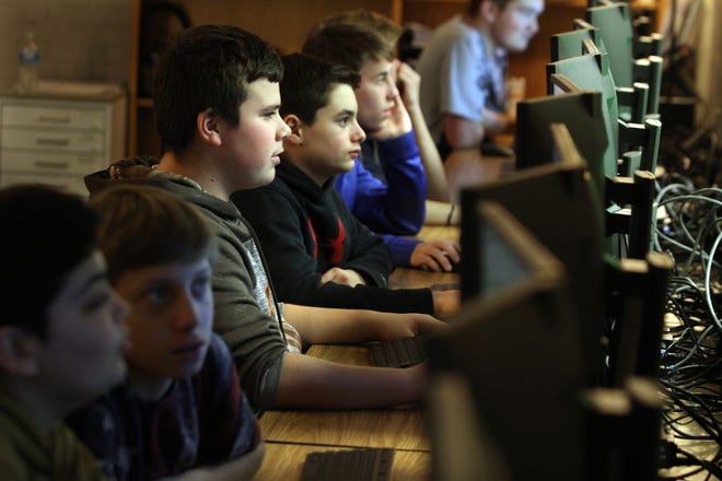 Students at Ponaganset High School work in the computer science essentials class last year, part of the career and technical programs offered at the school. [The Providence Journal, file / Bob Breidenbach]