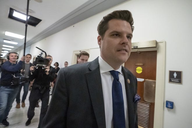 Rep. Matt Gaetz, R-Fla., a member of the House Judiciary Committee, walks past the House Oversight hearing featuring Michael Cohen, President Donald Trump's former personal lawyer, on Capitol Hill in Washington on Wednesday. [J. SCOTT APPLEWHITE/AP]