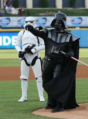 Darth Vader throws out the first pitch at a prior "Star Wars Night" at Dell Diamond, which will once again host such a theme night this season for the Round Rock Express. [JAMIE HARMS FOR ROUND ROCK LEADER]