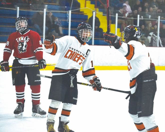 Cheboygan senior forwards Jaden Lindle (middle) and Anthony Steiner (right) celebrate a goal scored by Steiner that put the Chiefs up 2-0 in the second period of a Division 3 regional semifinal contest against Tawas in Gaylord on Thursday.