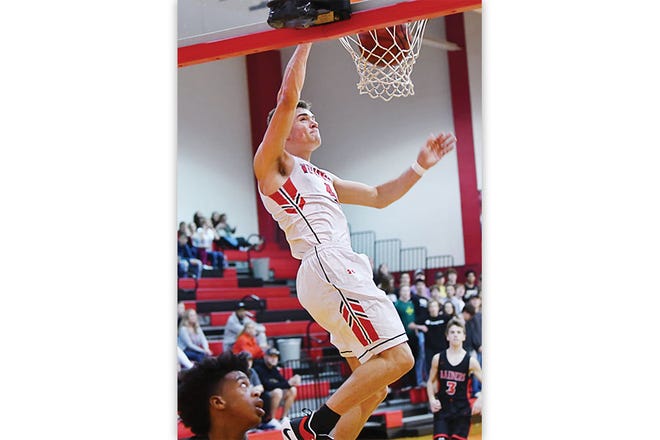 SOARING — Gavin Rains records a dunk for the Warriors.