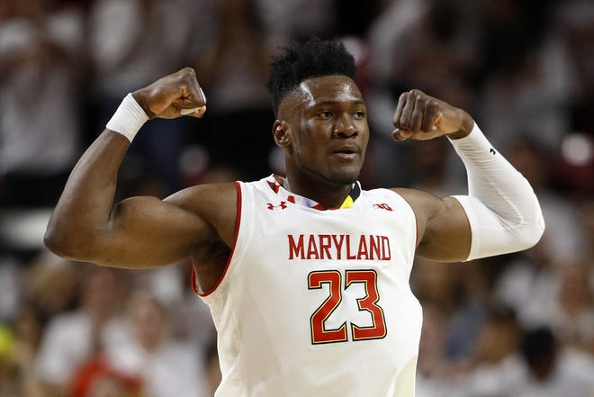 Maryland forward Bruno Fernando gestures after scoring in the second half of a game against Ohio State on Saturday in College Park, Md. Maryland won 72-62. [AP Photo/Patrick Semansky]
