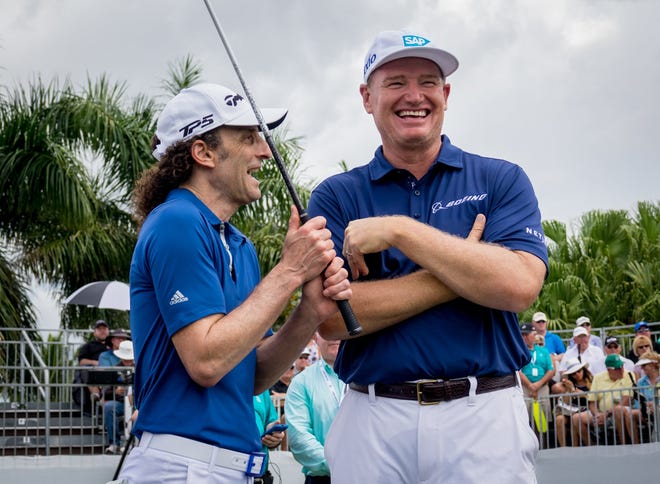 Musician Kenny G, left, and Ernie Els share a laugh before joining their groups during the Honda Classic Cares Pro-Am Wednesday in Palm Beach Gardens. [RICHARD GRAULICH/palmbeachpost.com]