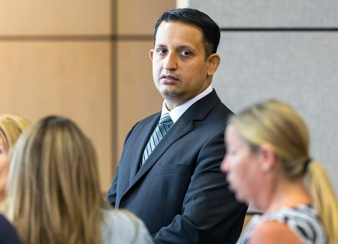 Former Palm Beach Gardens police officer Nouman Raja stands in court during a break in his trial Tuesday in West Palm Beach. Raja is charged with the fatal 2015 shooting of a stranded black motorist, 31-year-old Corey Jones. [LANNIS WATERS/THE ASSOCIATED PRESS]