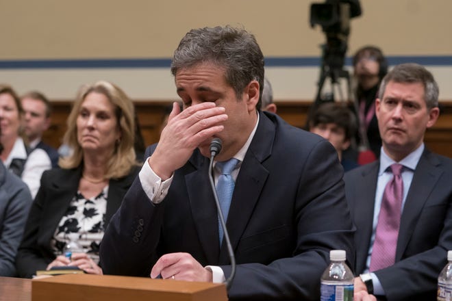 Michael Cohen, President Donald Trump's former personal lawyer, becomes emotional as he finishes a day of testimony to the House Oversight and Reform Committee, on Capitol Hill in Washington, Wednesday, Feb. 27, 2019. (AP Photo/J. Scott Applewhite)