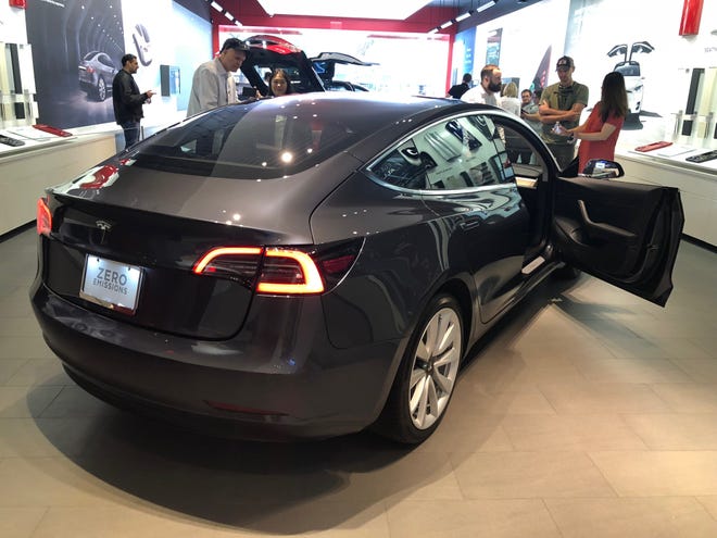 Tesla's Model 3 vehicle went on display last year at the company's showroom at the Domain in Austin. Tesla effort to convince Texas lawmakers to let it open actual dealerships in the state appears to be on hold, after the company announced Thursday that it's changing its business model to only sell cars over the Internet. [Omar L. Gallaga/American-Statesman/File]