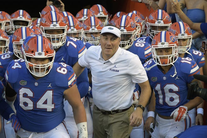 Florida head coach Dan Mullen will lead the Gators into his second season at the helm against Miami in Orlando. The game may be moved up a week to Aug. 24. [AP Photo/Phelan M. Ebenhack, File]