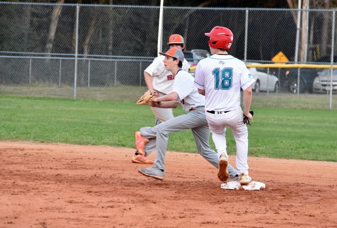 Destin's Caleb Reeder is safe at second in the game against the Freeport Bulldogs. Reeder connected for two hits in the 12-1 middle school victory. [TINA HARBUCK/THE LOG]