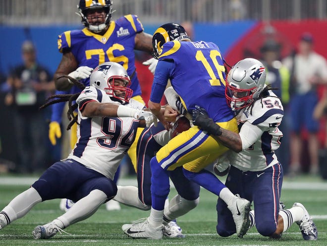 Adrian Clayborn, Dont'a Hightower and Kyle Van Noy sack Jared Goff during Super Bowl LIII.
