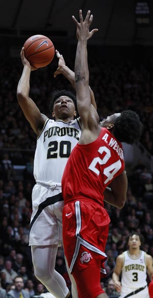 Purdue guard Nojel Eastern (20) shoots the basketball defended by Ohio State forward Andre Wesson in the second half of an NCAA college basketball game, Saturday, March 2, 2019, in West Lafayette, Ind. Purdue won 86-51. (AP Photo/R Brent Smith)