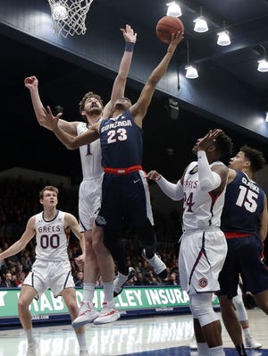 Gonzaga guard Zach Norvell Jr. (23) shoots in front of Saint Mary's center Jordan Hunter during the first half of an NCAA college basketball game in Moraga, Calif., Saturday, March 2, 2019. (AP Photo/Jeff Chiu)