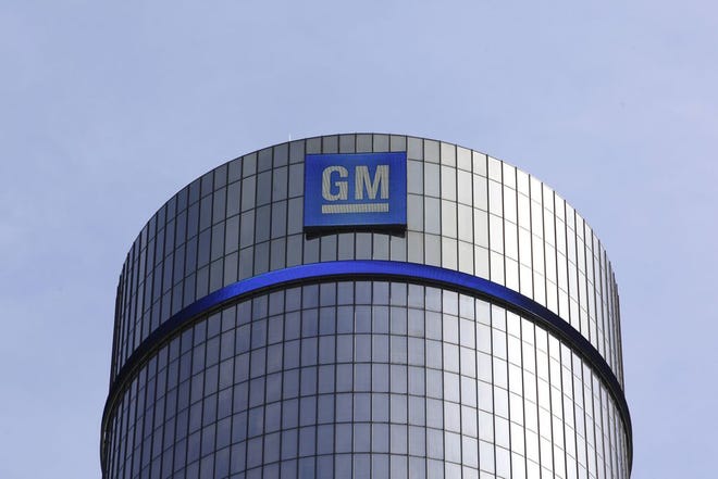 This May 5, 2011 file photo shows General Motors headquarters in Detroit. The General MotorsþÄô massive 14,000-person layoff announced last Nov. 2018 might not be as bad as originally projected. The company said Friday, Dec. 14, 2018, that 2,700 out of the 3,300 factory jobs slated for elimination will now be saved by adding jobs at other U.S. factories. Blue-collar workers in many cities will still lose jobs when GM shutters four U.S. factories next year. But most could find employment at other GM plants. Some would have to relocate. (AP Photo/Paul Sancya, File)