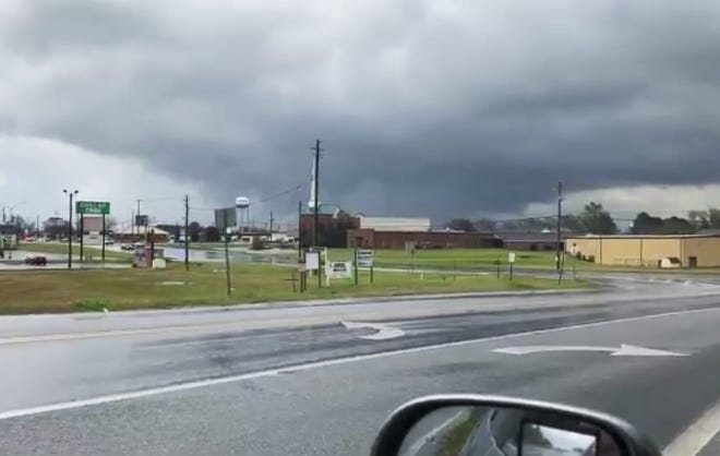 This photo provided by Greg Martin shows a funnel cloud in Byron, Ga., Sunday. The National Weather Service issued a series of tornado warnings stretching from Phenix City, Ala., near the Georgia state line to Macon, Ga., about 100 miles to the east. [The Associated Press]