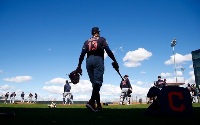 File- This Feb. 18, 2019, file photo shows Cleveland Indians' Leonys Martin getting ready to take batting practice at the Indians spring training baseball facility in Goodyear, Ariz. Martin, who is making a dramatic comeback after nearly dying last season from a bacterial virus. Martin homered in today’s exhibition game and he’s been having a solid training camp with the Indians, who are hoping the 31-year-old can help them this season. Martin feels lucky to be alive following his ordeal. (AP Photo/Ross D. Franklin, File)