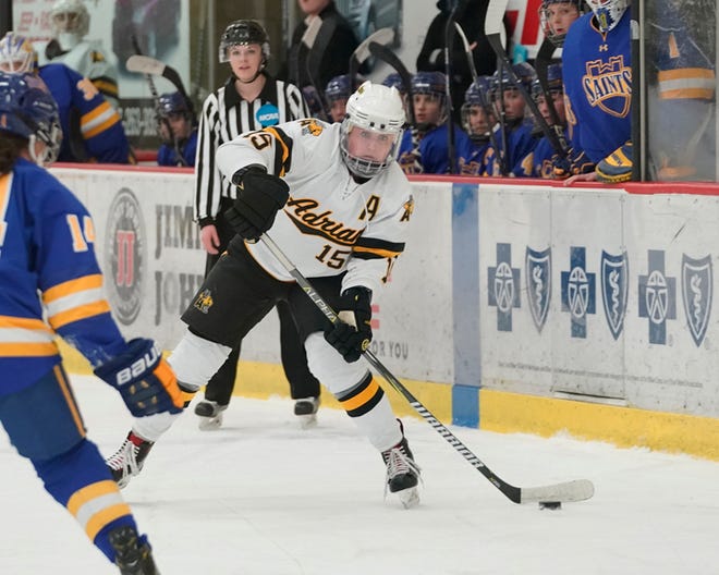 Adrian College junior Kelly O'Sullivan looks to shoot the puck up the ice during Sunday's Slaats Cup finals.