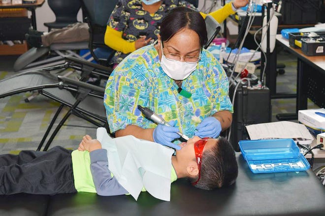 Dentists with Big Smiles Virginia PC, known as "Smile Virginia" provide preventative and restorative dental services to North Elementary School students free of charge on Feb. 21 and 22. [Contributed Photo/Hilary Restom]
