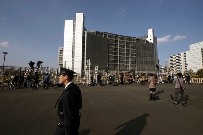 Step ladders placed by photographers and cameramen are seen in front of Tokyo Detention Center, where former Nissan Chairman Carlos Ghosn is detained, Tuesday, March 5, 2019, in Tokyo. The Tokyo District Court approved the release of Ghosn on 1 billion yen ($9 million) bail on Tuesday, ending nearly four months of detention. (AP Photo/Eugene Hoshiko)