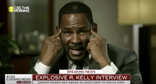 In this frame from video provided by CBS, R. Kelly talks during an interview with Gayle King on "CBS This Morning" broadcast Wednesday. The R&B singer gave his first interview since being charged last month with sexually abusing four females dating back to 1998, including three underage girls. Kelly has pleaded not guilty to 10 counts of aggravated sexual abuse. [CBS via AP]