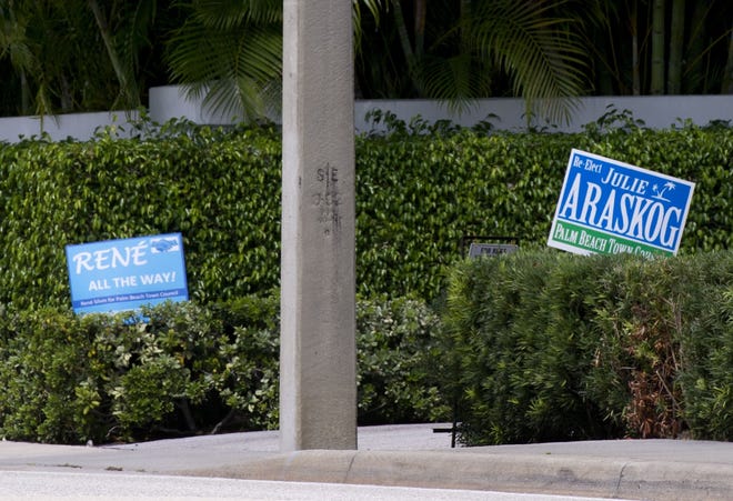 Campaign signs for Rene Silvin and Julie Araskog, who are running for the same Town Council seat, can be seen Tuesday along South County Road. [Meghan McCarthy/palmbeachdailynews.com]