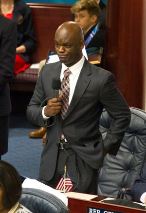 Rep. Kionne McGhee reacts to the Florida House of Representatives refusing to hear a bill to ban assault rifles and large capacity magazines he was trying to bring to the floor at the state Capital in Tallahassee on Feb 20, 2018. [AP Photo / Mark Wallheiser]