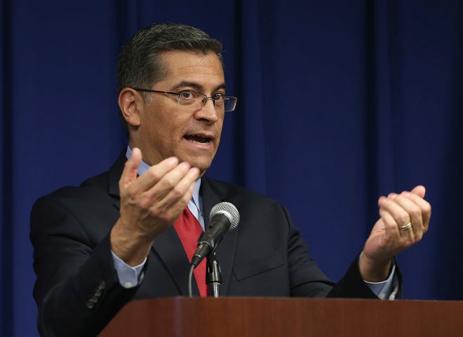 California Attorney General Xavier Becerra discusses the decision that his office will not file charges against the two Sacramento Police officers in last years fatal shooting of Stephon Clark, during a news conference, Tuesday, March 5, 2019, in Sacramento, Calif. (AP Photo/Rich Pedroncelli)