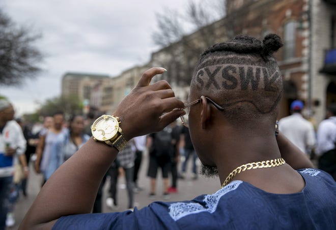 South by Southwest is prime time for spotting fashion, like Florida rapper Henbo the Palm Beach Nigerian, who sported the SXSW logo shaved into his head last year on Sixth Street. [JAY JANNER / AMERICAN-STATESMAN 2018]