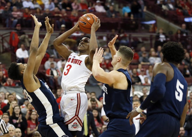 Ohio State Buckeyes guard C.J. Jackson (3) takes a shot between Penn State Nittany Lions guard Josh Reaves (23), forward John Harrar (21) and guard Jamari Wheeler (5) during the second half of the NCAA basketball game at Value City Arena on Feb. 7, 2019. The Ohio State Buckeyes won 74-70. [Adam Cairns/Dispatch]