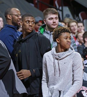 Ohio State basketball recruits Alonzo Gaffney (left) and Meechie Johnson (right), both of Garfield Heights High School, attend Saturday's NCAA Division I basketball game between the Buckeyes and the Iowa Hawkeyes at Value City Arena in Columbus on February 10, 2018. [Barbara J. Perenic/Dispatch]