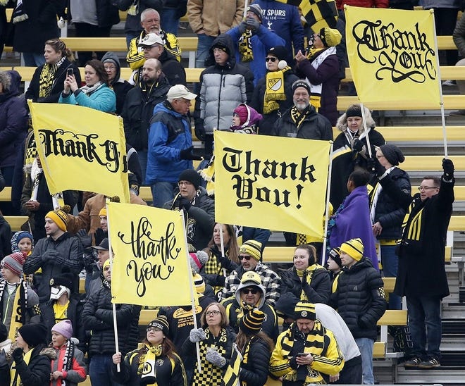 Fans hold up thank you signs before an MLS soccer game between the Columbus Crew SC and the New York Red Bulls at Mapfre Stadium on Saturday, March 2, 2019. [Fred Squillante]