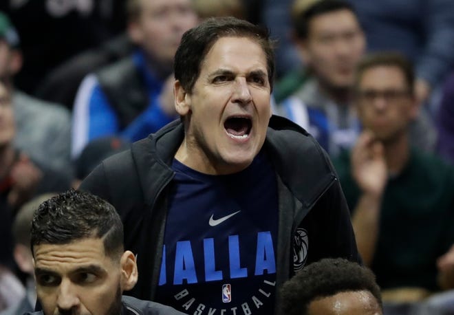 FILE - In this Dec. 8, 2017, file photo, Dallas Mavericks owner Mark Cuban yells after a technical foul during the second half of the team's NBA basketball game against the Milwaukee Bucks in Milwaukee. Cuban is talking once again about running for president and this time no one is laughing--at least publicly--at the thought. (AP Photo/Morry Gash, File)