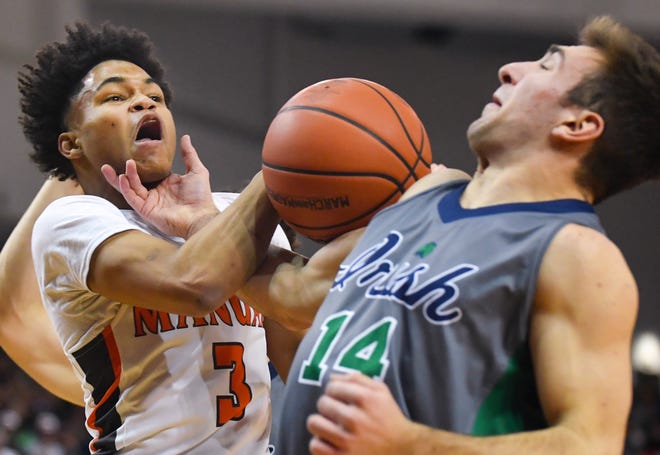 RON JOHNSON/JOURNAL STAR David Czirjak of Peoria Notre Dame gets a hand to the neck of Manual's Quintez Edwards as he reaches for the ball during the Class 3A Peoria Sectional final on Friday.