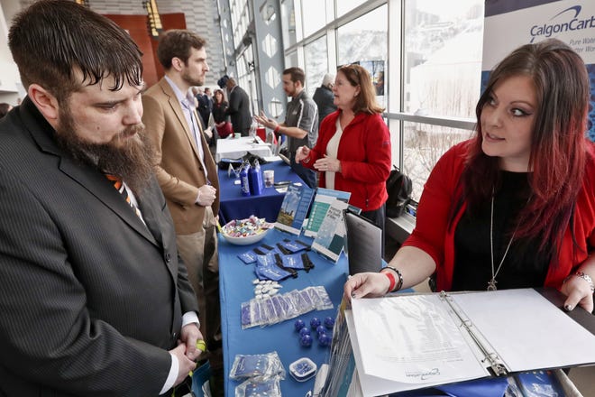 Visitors to the Pittsburgh veterans job fair meet with recruiters Thursday at Heinz Field in Pittsburgh. [AP Photo]