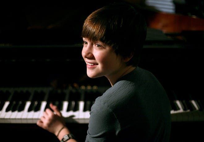 Greyson Chance talks about his new Yamaha piano at his family's home in Edmond on Friday, Oct. 8, 2010. [The Oklahoman Archives]
