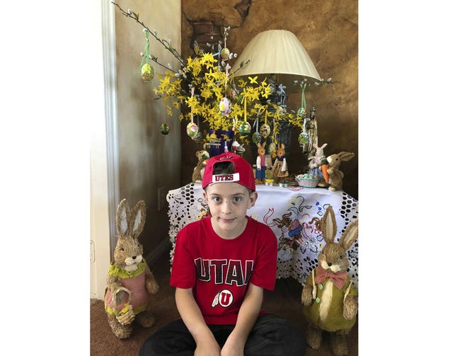 This April 1, 2018 photo provided by Karen Fisher shows fourth-grader William McLeod at his home in Bountiful, Utah. A teacher in the predominantly Mormon state was placed on administrative leave Thursday, March 7, 2019 after she forced McLeod, a Catholic student to wash off the Ash Wednesday cross from his forehead. (Karen Fisher via AP)