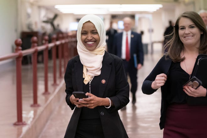 Rep. Ilhan Omar, D-Minn., walks to the chamber Thursday, March 7, 2019, on Capitol Hill in Washington, as the House was preparing to vote on a resolution to speak out against, as Speaker of the House Nancy Pelosi said, "anti-Semitism, anti-Islamophobia, anti-white supremacy and all the forms that it takes," an action sparked by remarks from Omar. (AP Photo/J. Scott Applewhite)