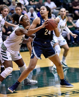 South Florida's Shae Leverett, left, defends against Connecticut's Napheesa Collier (24) during the second half of an NCAA basketball game Monday, March 4, 2019, in Tampa, Fla. (AP Photo/Steve Nesius)