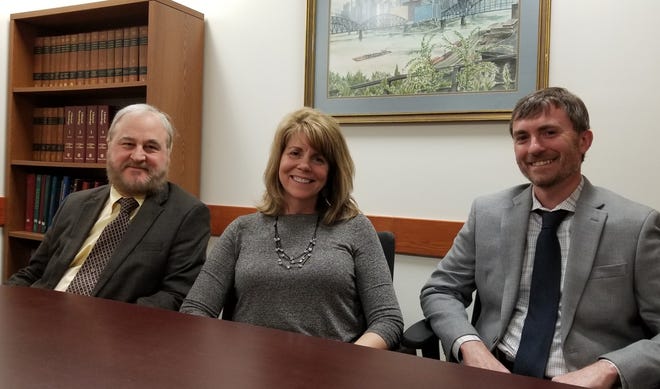 Dr. Brian R. Ott, head of Rhode Island Hospital’s Alzheimer’s Disease & Memory Disorders Center, discusses diagnosis, treatment and research with members of his team, Doctors Lori Ann Daiello and Jonathan D. Drake. [The Providence Journal / G. Wayne Miller]