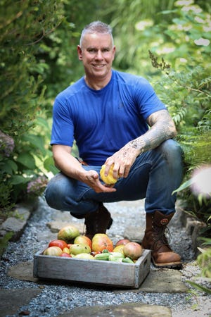 No wonder author Matt Mattus looks happy — look what he just harvested from his garden. [Matt Mattus/“Mastering the Art of Vegetable Gardening” Cool Springs]