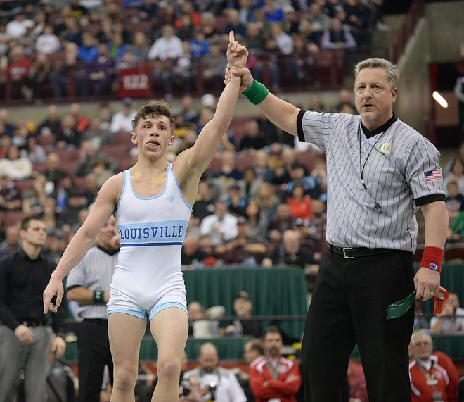 Louisville's Davin Rhoads has his hand raised after winning the 126-pound title in the Division II OHSAA State Wrestling Tournament, March 9, 2019. (CantonRep.com / Ray Stewart)
