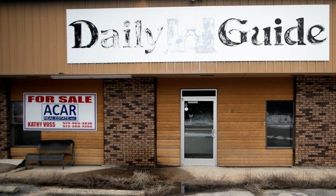 In this Feb. 19, 2019 photo, the old Daily Guide office stands for sale in St. Robert, Mo. With the shutdown of the newspaper in September 2018, this area in central Missouri's Ozark hills joined more than 1,400 other cities across the United States to lose a newspaper over the past 15 years, according to an Associated Press analysis of data compiled by the University North Carolina. (AP Photo/Orlin Wagner)