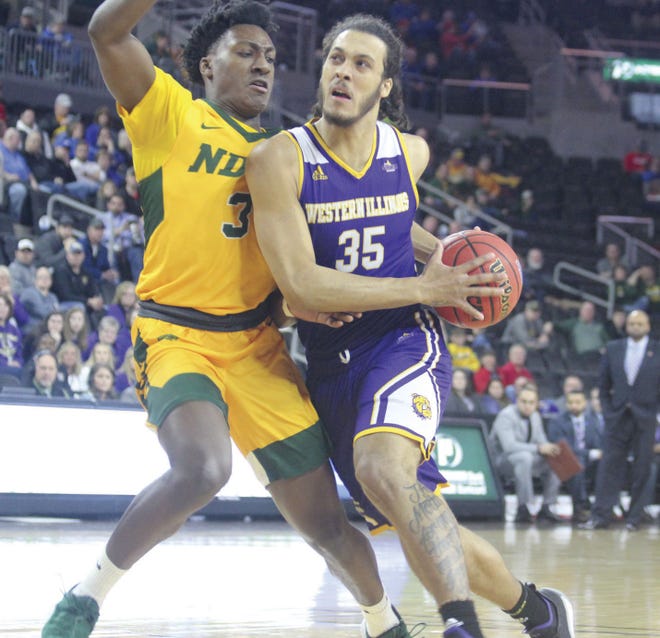 Western Illinois' Isaac Johnson (35) drives to the basket in the first half of Monday's Summit League Tournament semifinal against North Dakota State. [Scott Holland/McDonough County Voice]