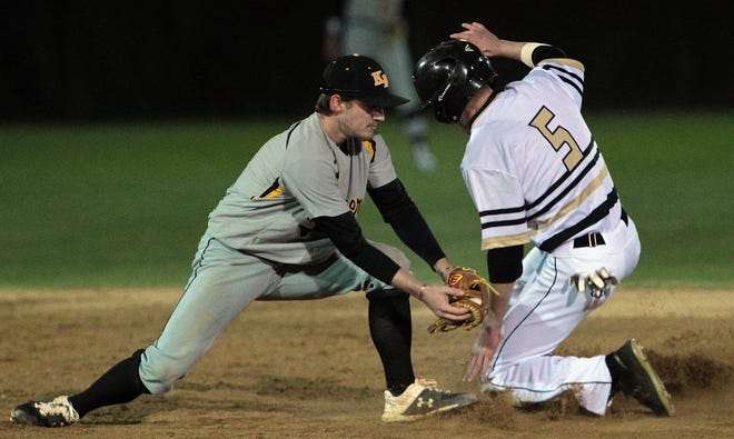 Kings Mountian David Bell misses the tag on North Gaston's Jackson Finger as he stole second base as North Gaston hosted King Mountain in baseball Thursday evening, March 7, 2019. [Mike Hensdill/The Gaston Gazette]