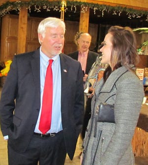 Al Landis, l, Tuscarawas County Commissioner and speaker for the Newcomerstowh Chamber banquet, speaks with Ashley Karlen, director constituent services for Cong. Bill Johnson.