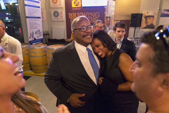 Newly elected Mayor Keith James celebrating with his wife Lorna James at the West Palm Brewery & Wine Vault on Tuesday, March 12, 2019 in West Palm Beach, Florida. [GREG LOVETT/palmbeachpost.com]