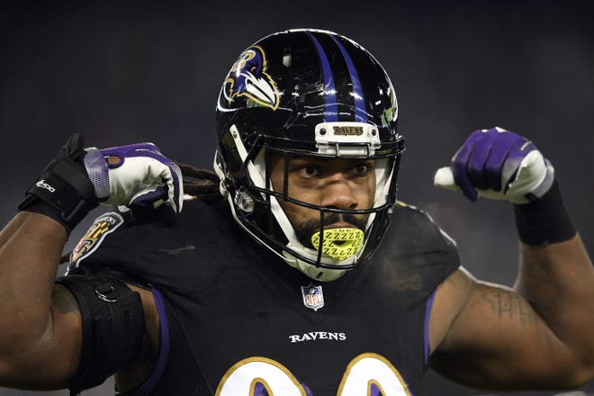In this Dec. 30, 2018, photo, Baltimore Ravens outside linebacker Za'Darius Smith gestures in the first half against the Cleveland Browns in Baltimore. The Green Bay Packers agreed to $183 million worth of contracts Tuesday, March 12, 2019, with edge rusher Za'Darius Smith, linebacker Preston Smith, safety Adrian Amos and offensive lineman Billy Turner. The signings should improve a defense that ranked 18th in the NFL in 2018 and add some more protection for quarterback Aaron Rodgers. [NICK WASS/THE ASSOCIATED PRESS]