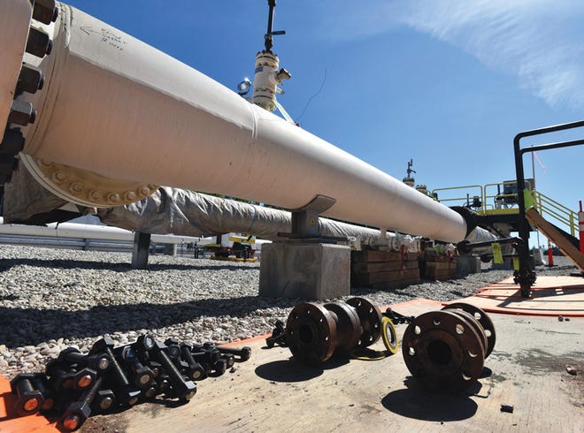 In this June 2017 file photo, fresh nuts, bolts and fittings are ready to be added to the east leg of the pipeline near St. Ignace, as Canadian oil transport company Enbridge prepares to test the east and west sides of the Line 5 pipeline under the Straits of Mackinac.